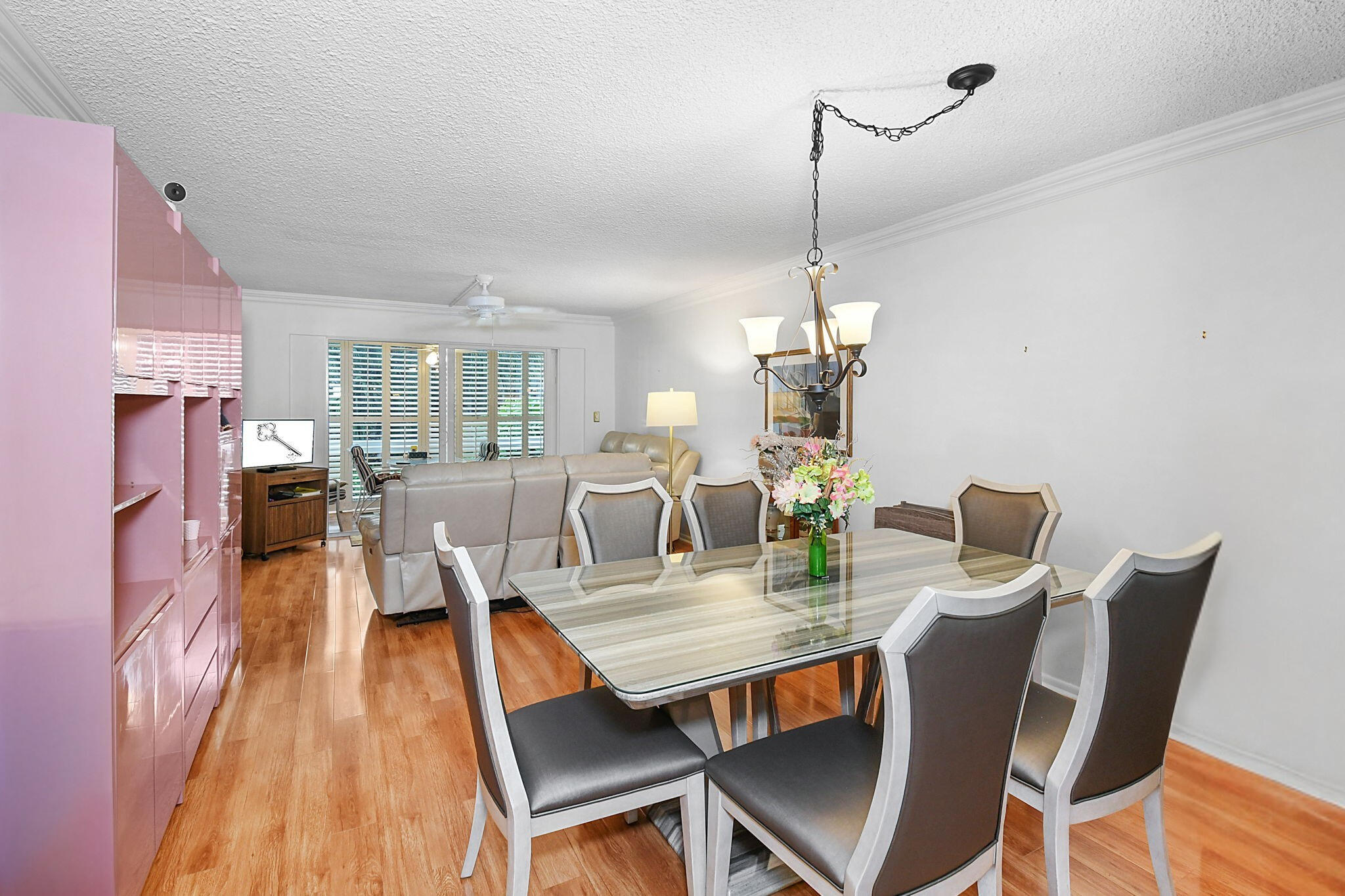 400 Northeast 20th Street, Unit A207 Boca Raton, FL 33431 - Photo 9 of 55 a view of a dining room with furniture window and wooden floor