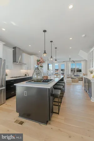 a kitchen with kitchen island granite countertop wooden cabinets and counter top space