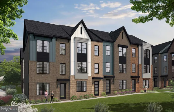 a front view of a residential apartment building with a yard