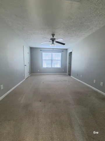 a view of empty room with windows