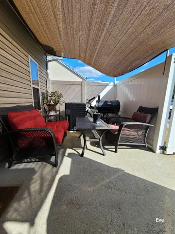 a bedroom with furniture and a ceiling fan