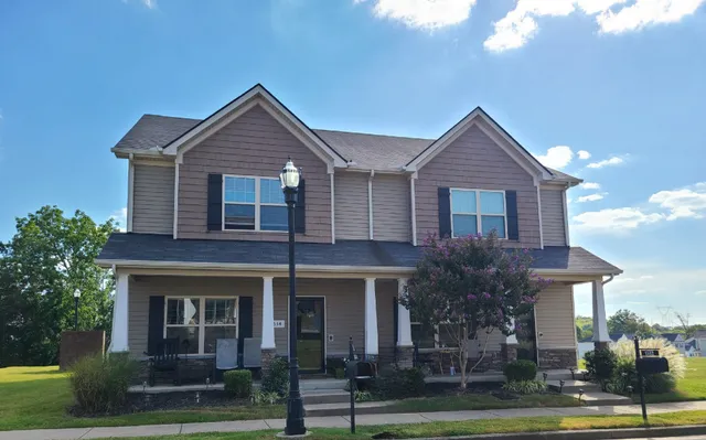 a front view of a house with a yard