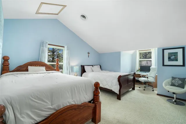 a bedroom with a bed and a couch