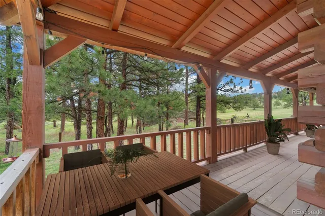 a view of a wooden chairs in the deck