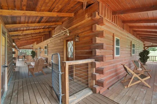 a view of a patio with table and chairs
