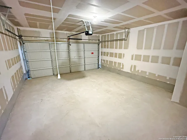 a view of an empty room with a garage