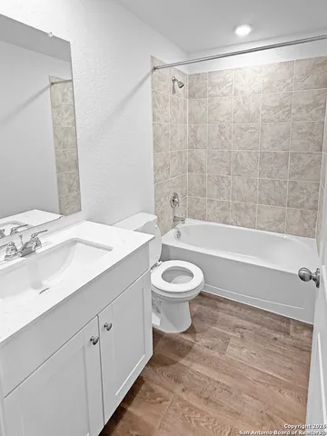 a bathroom with a sink a toilet and a bathtub