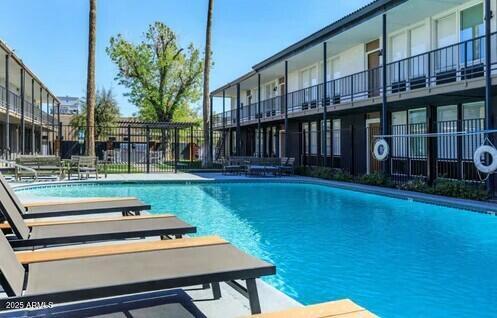 2339 West Northern Avenue, Unit 225 Phoenix, AZ 85021 - Photo 2 of 14 a backyard of a house with barbeque oven table and chairs