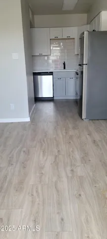 a view of a refrigerator in a kitchen