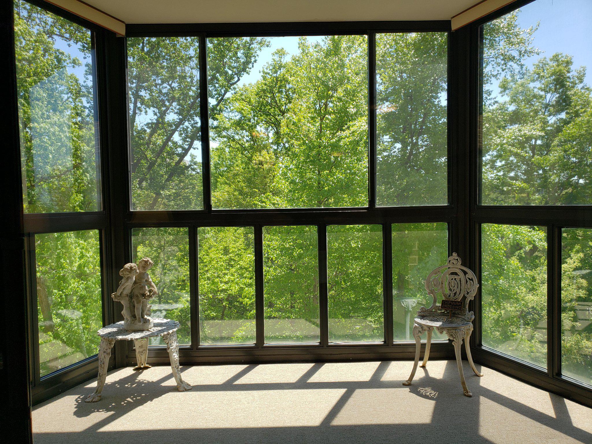 15100 Interlachen Drive, Unit 4520 Silver Spring, MD 20906 - Photo 7 of 39 Enclosed Balcony,Sunlit retreat with nature views.