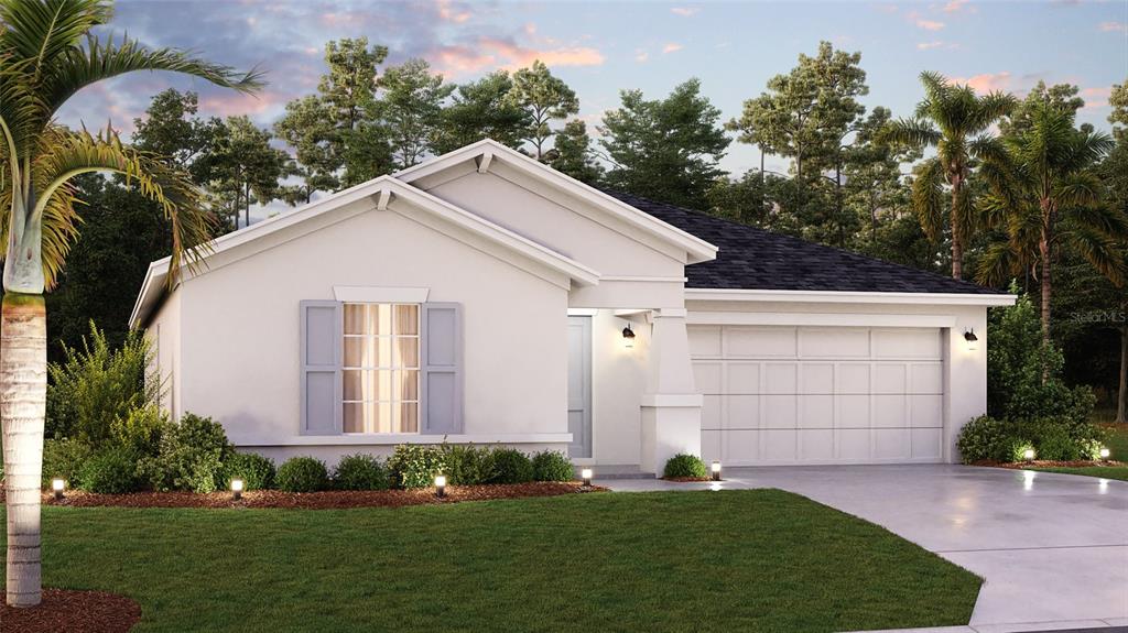 a view of a white house with yard and plants