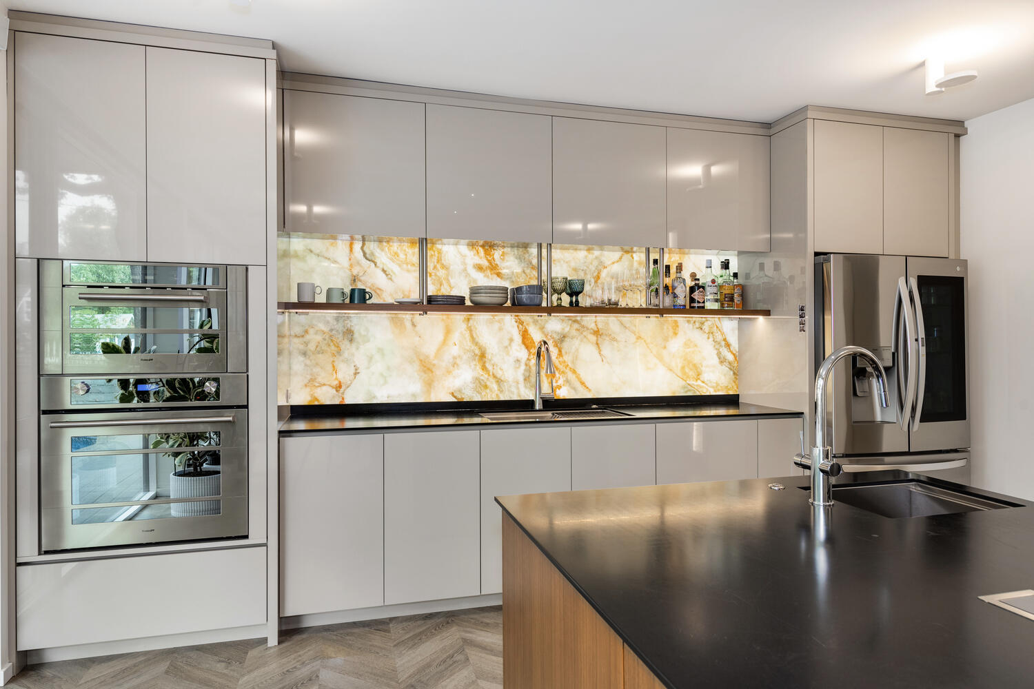 2333 Ridgeway Avenue Evanston, IL 60201 - Photo 12 of 35 a kitchen with stainless steel appliances granite countertop a refrigerator a stove and a sink with wooden floor