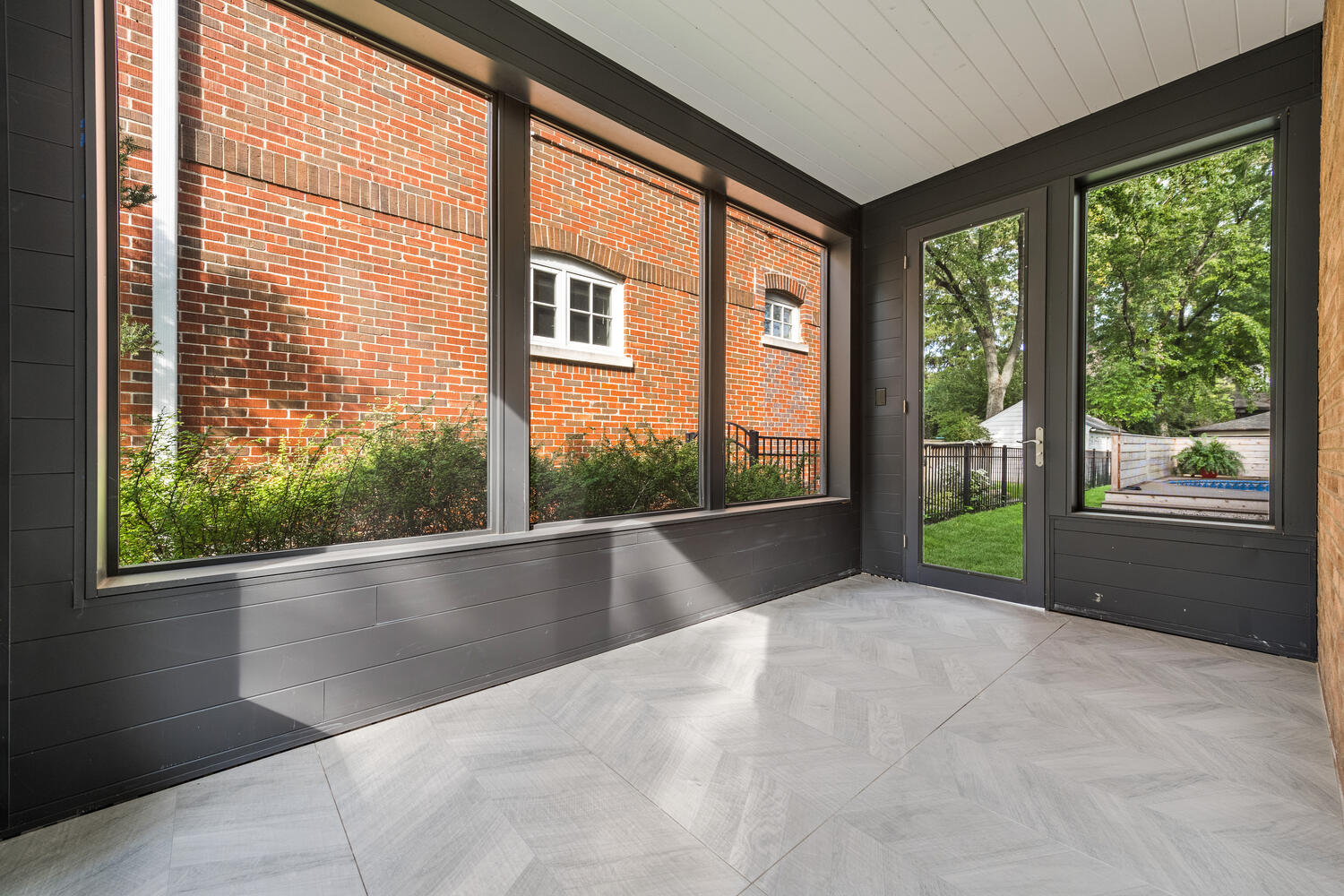 2333 Ridgeway Avenue Evanston, IL 60201 - Photo 15 of 35 a view of an empty room with wooden floor and a window