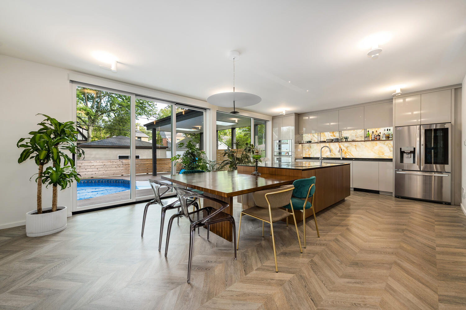 2333 Ridgeway Avenue Evanston, IL 60201 - Photo 8 of 35 a kitchen with stainless steel appliances kitchen island granite countertop a dining table chairs and granite counter tops