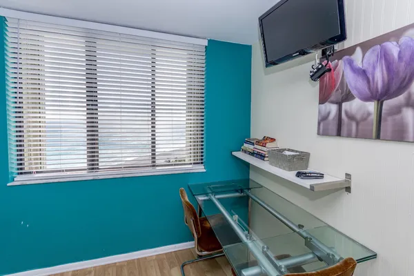 a room with a window and gym equipment