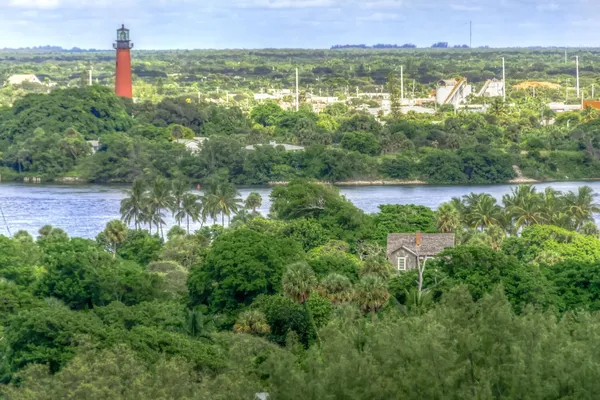 a body of water with a building in the background