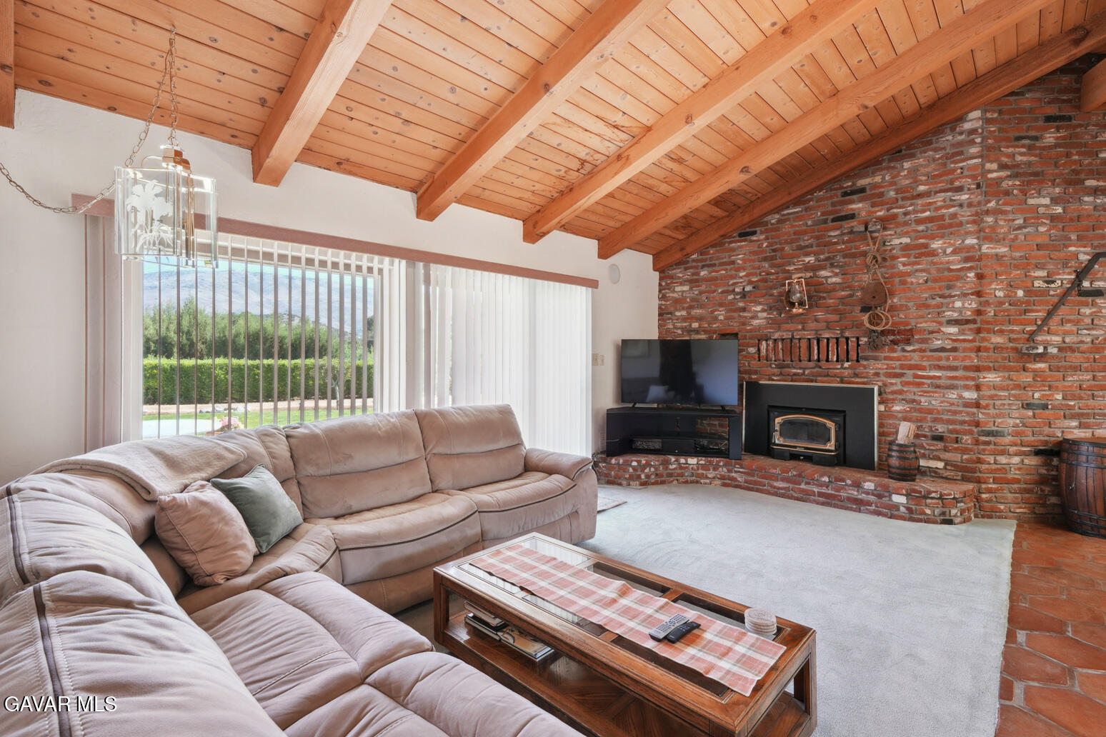 6020 Valley Sage Road Acton, CA 93510 - Photo 12 of 40 a living room with furniture a flat screen tv and a fireplace