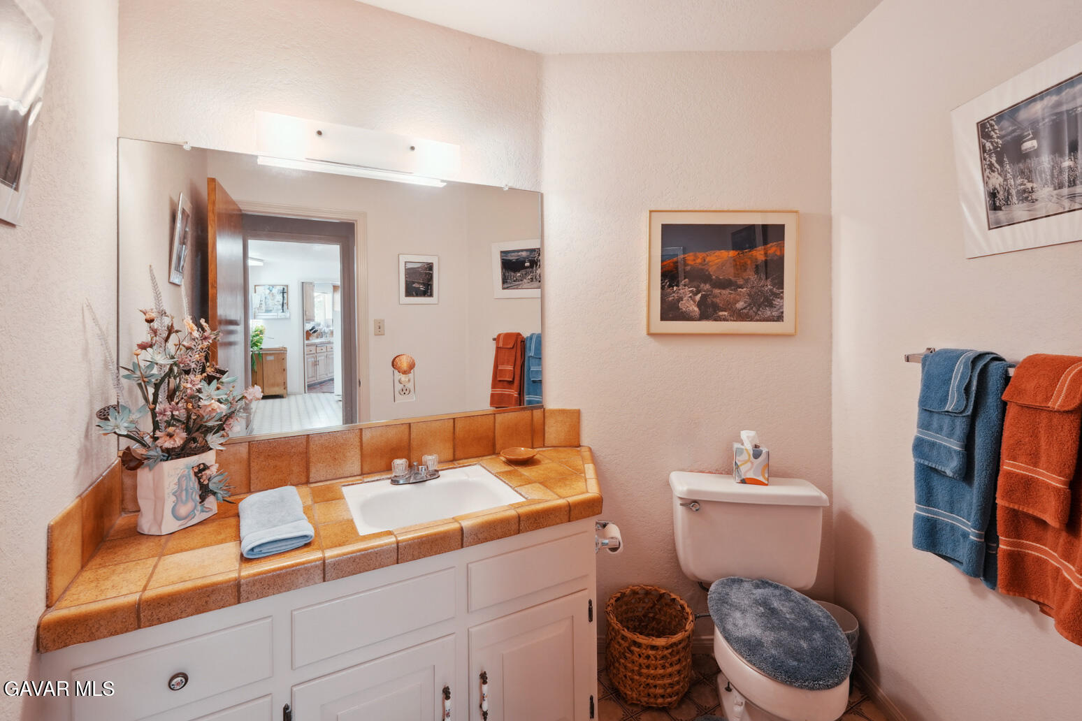 6020 Valley Sage Road Acton, CA 93510 - Photo 15 of 40 a bathroom with a toilet a sink and a mirror