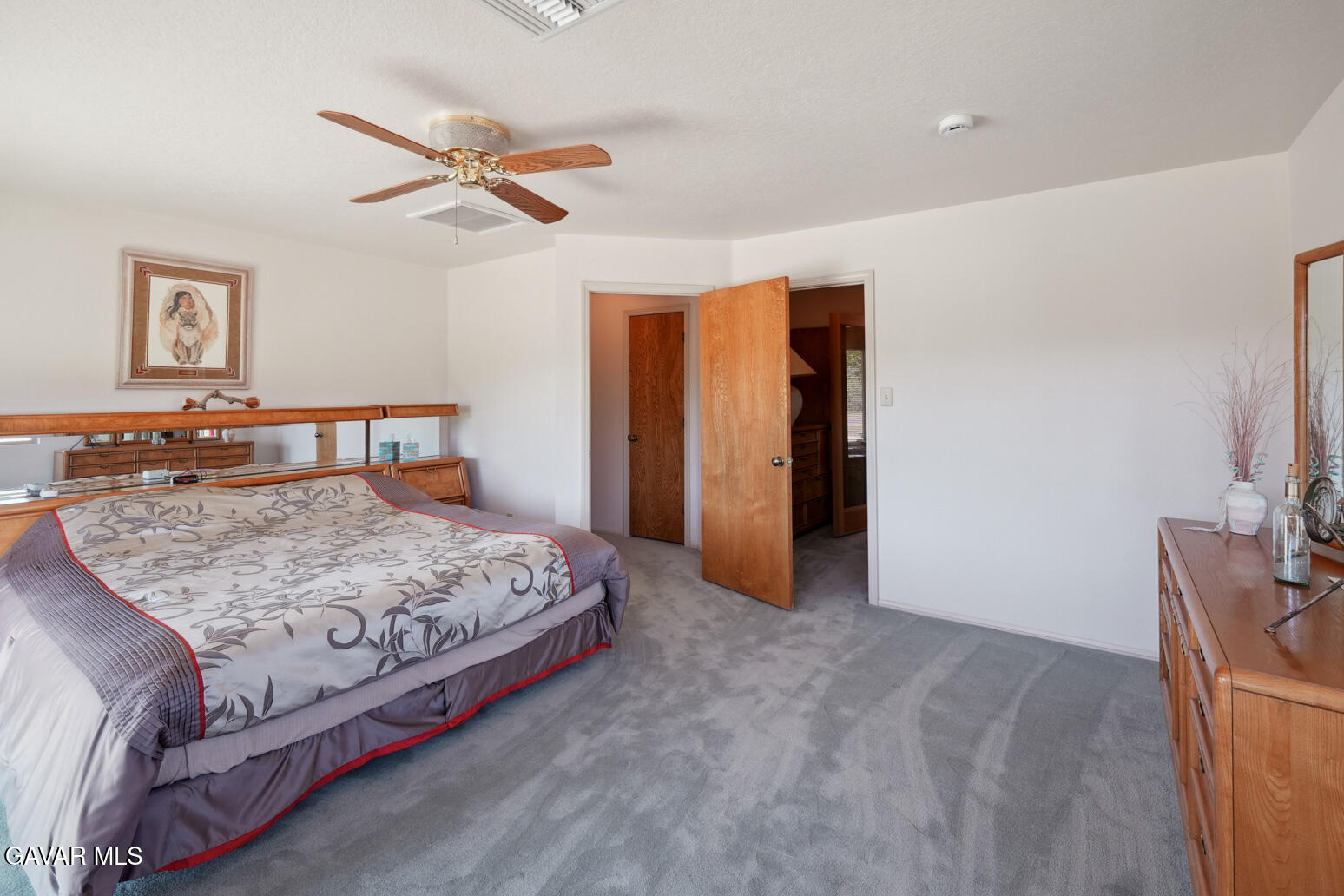 6020 Valley Sage Road Acton, CA 93510 - Photo 23 of 40 a bedroom with a bed and dresser with mirror