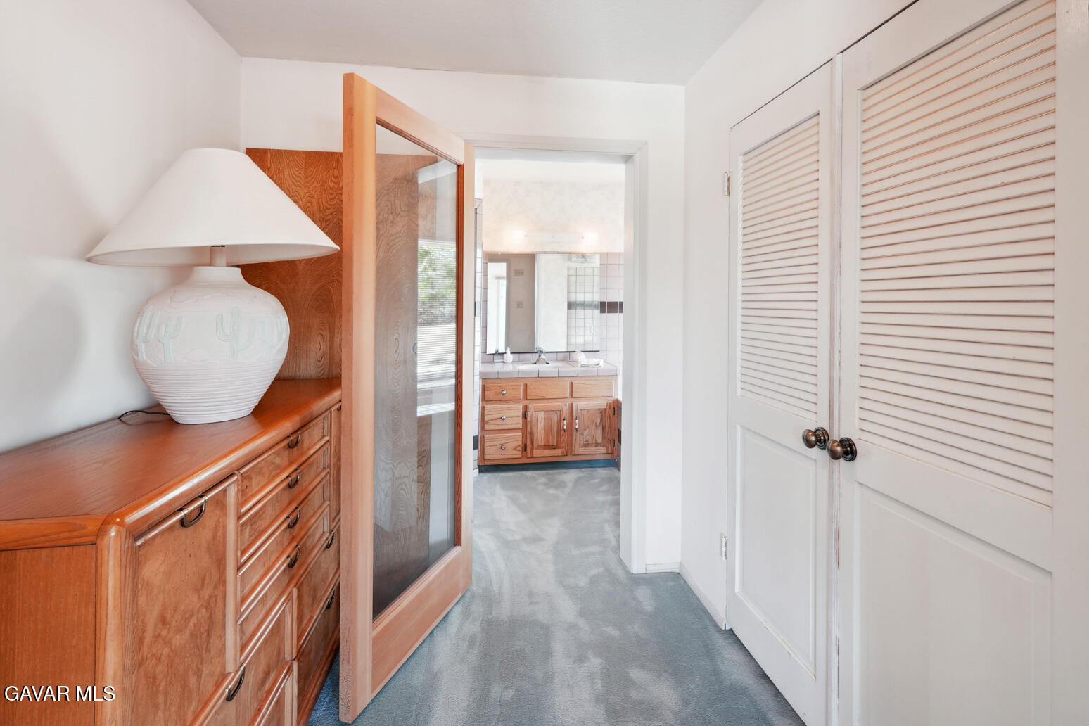 6020 Valley Sage Road Acton, CA 93510 - Photo 24 of 40 a view of a hallway and a room with wooden floor