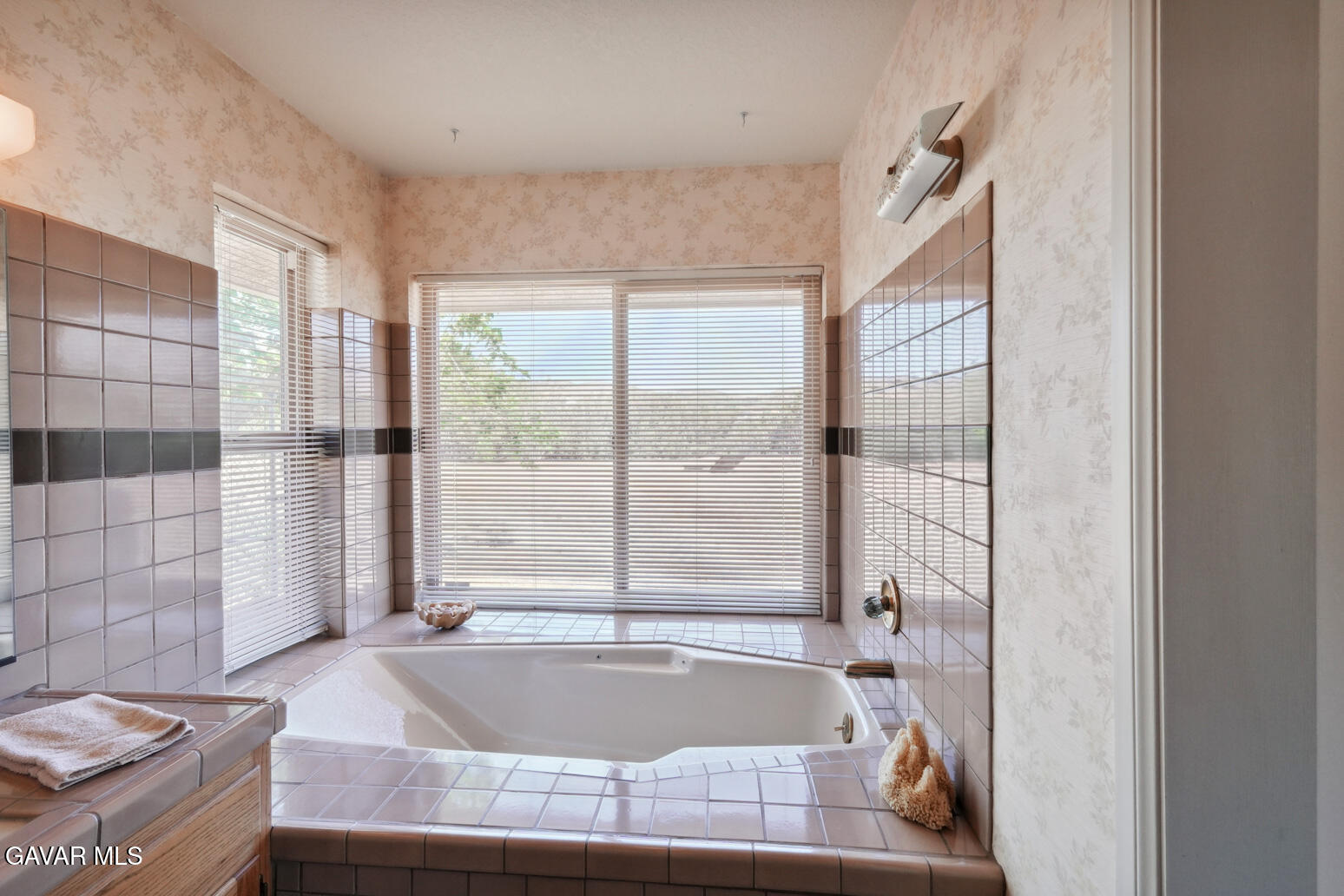 6020 Valley Sage Road Acton, CA 93510 - Photo 26 of 40 a bath tub sitting in a bathroom next to a window