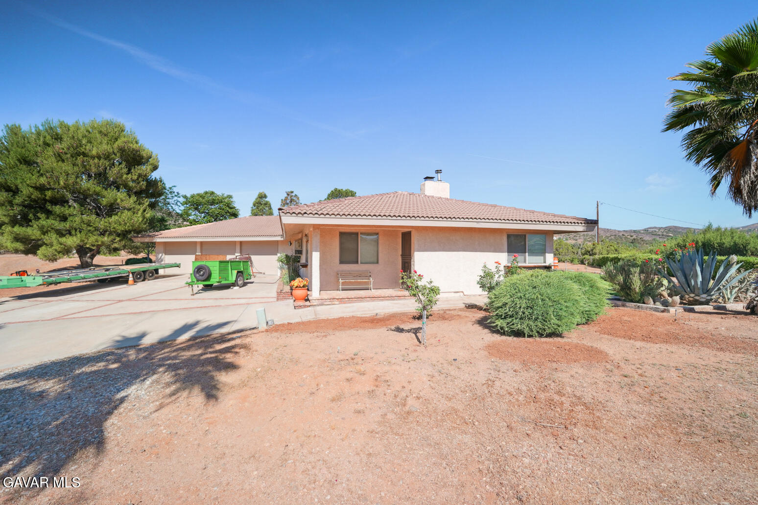 6020 Valley Sage Road Acton, CA 93510 - Photo 27 of 40 a view of a house with a yard and potted plants