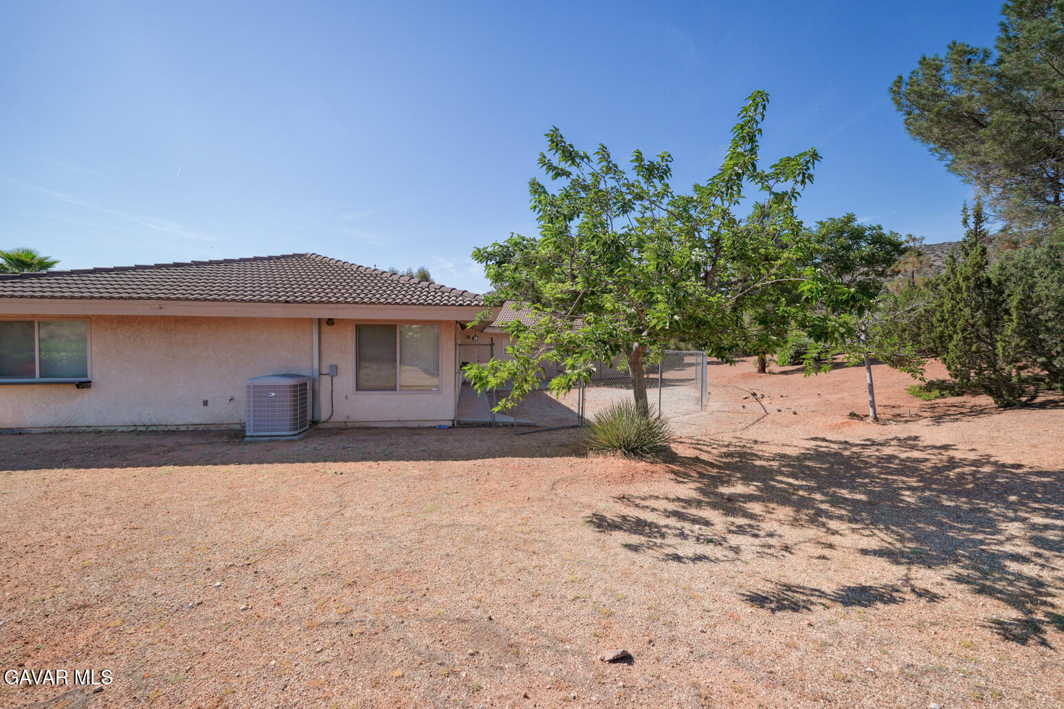 6020 Valley Sage Road Acton, CA 93510 - Photo 31 of 40 a front view of a house with a yard and a garage