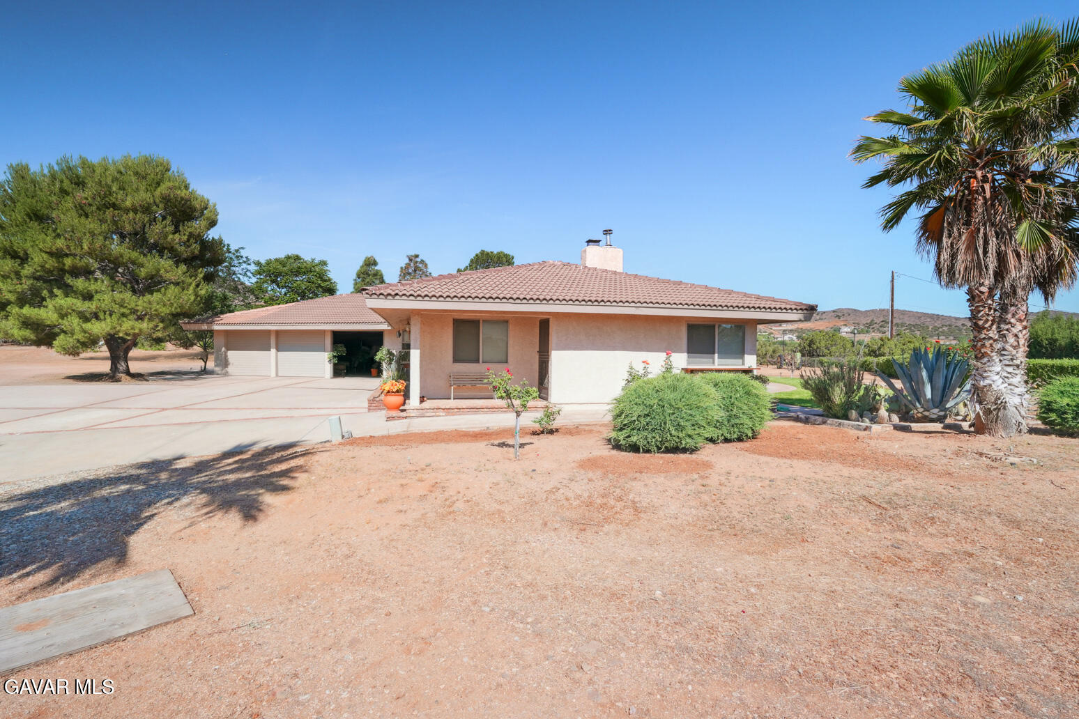 6020 Valley Sage Road Acton, CA 93510 - Photo 37 of 40 a front view of a house with yard and parking
