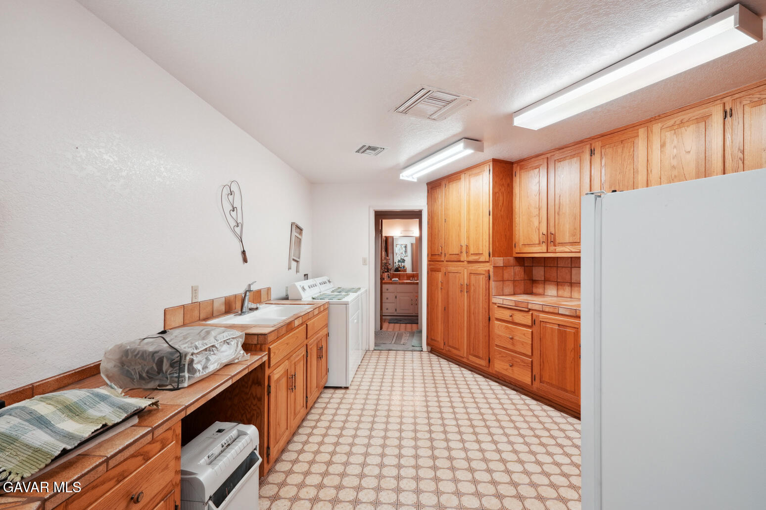 6020 Valley Sage Road Acton, CA 93510 - Photo 8 of 40 a kitchen with stainless steel appliances granite countertop a sink stove and refrigerator