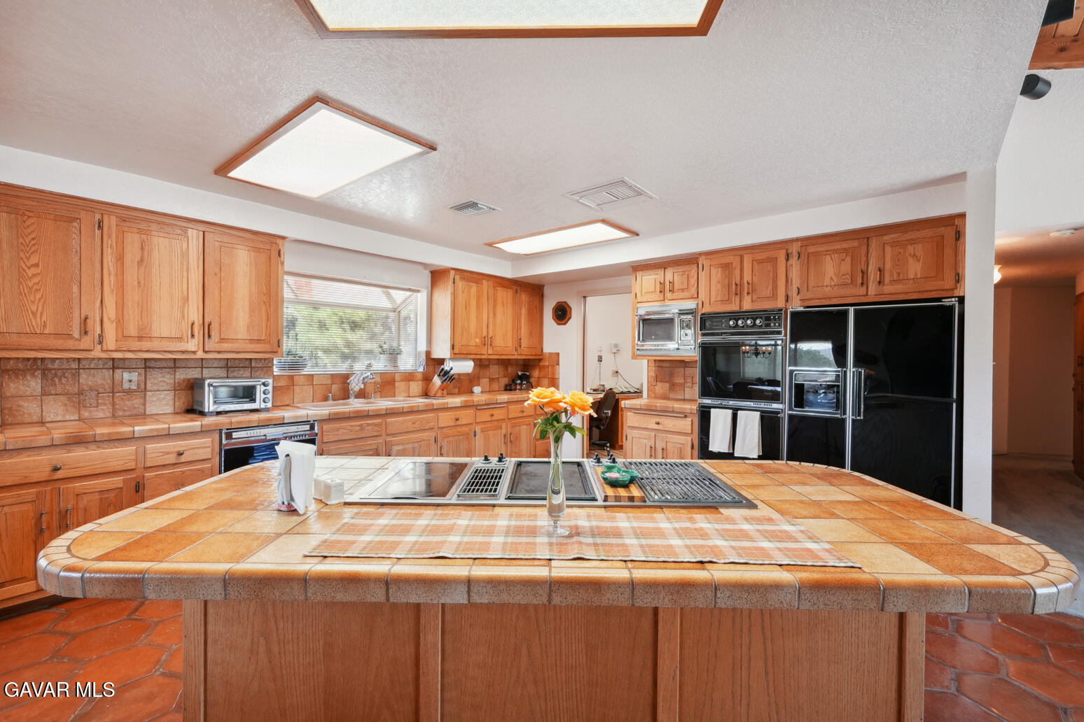 6020 Valley Sage Road Acton, CA 93510 - Photo 10 of 40 a large kitchen with stainless steel appliances granite countertop a sink and cabinets
