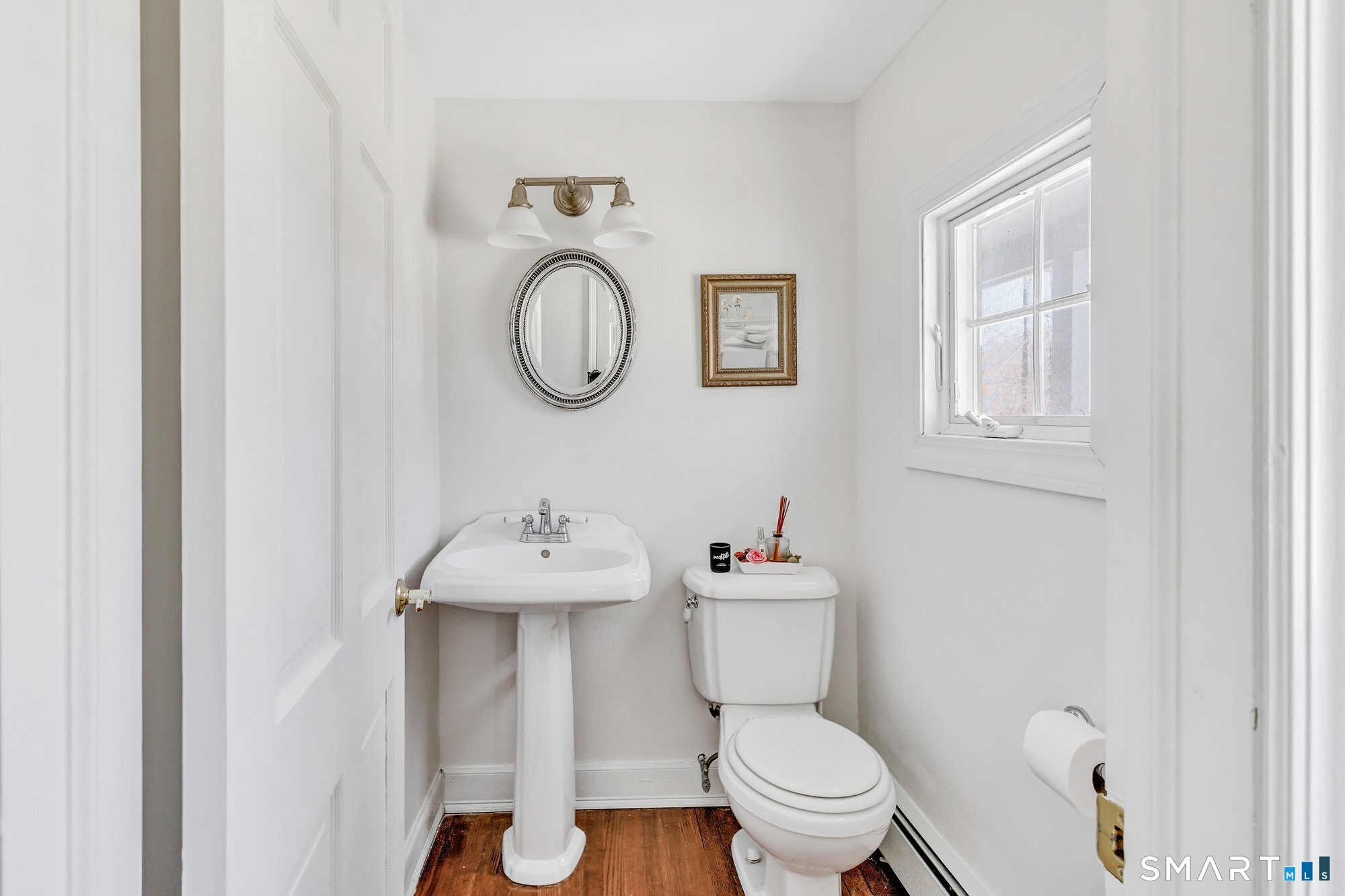 39 Marion Road Westport, CT 06880 - Photo 11 of 46 a bathroom with a sink toilet and a mirror
