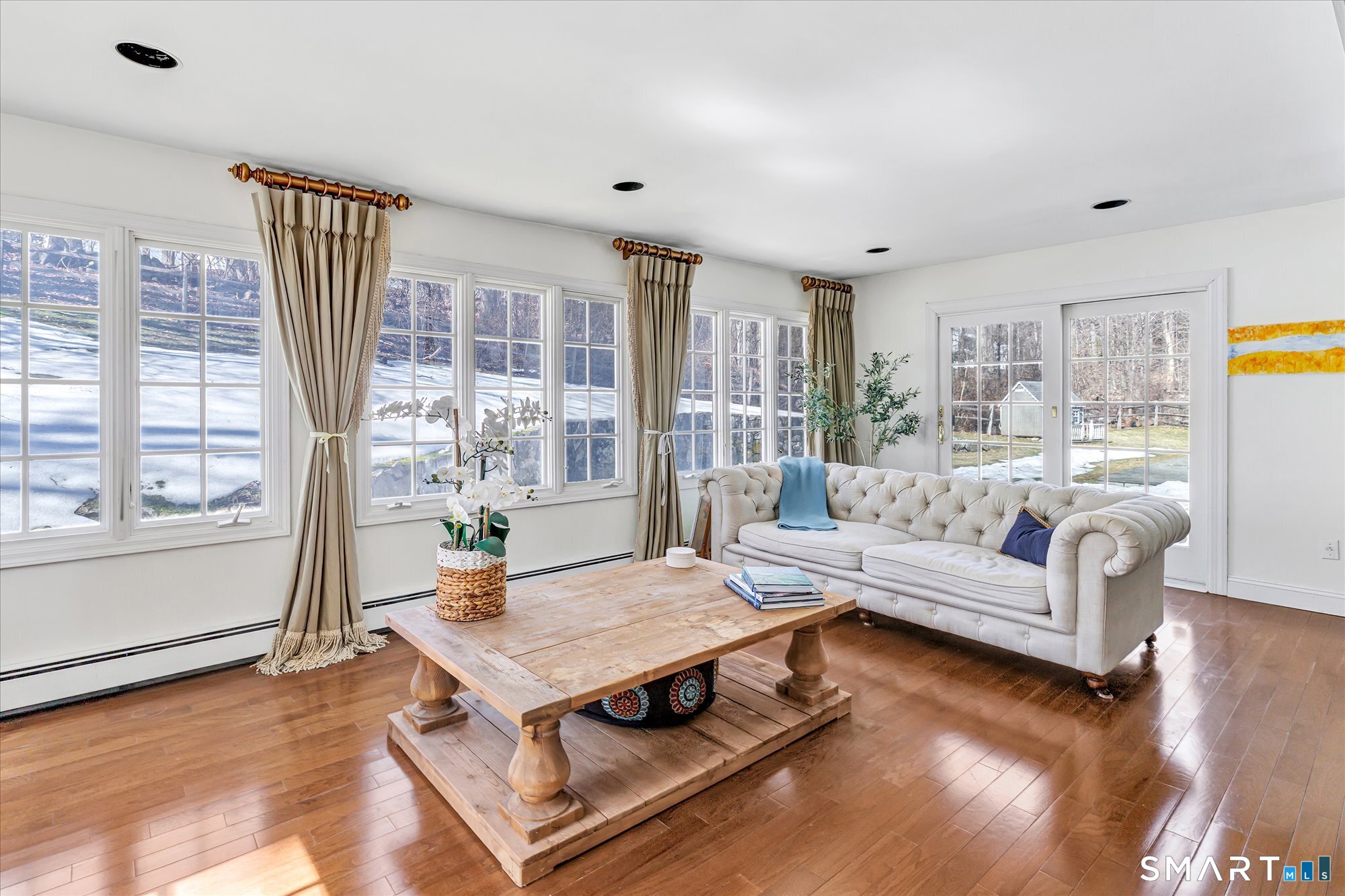 39 Marion Road Westport, CT 06880 - Photo 12 of 46 a living room with furniture a table and wooden floor