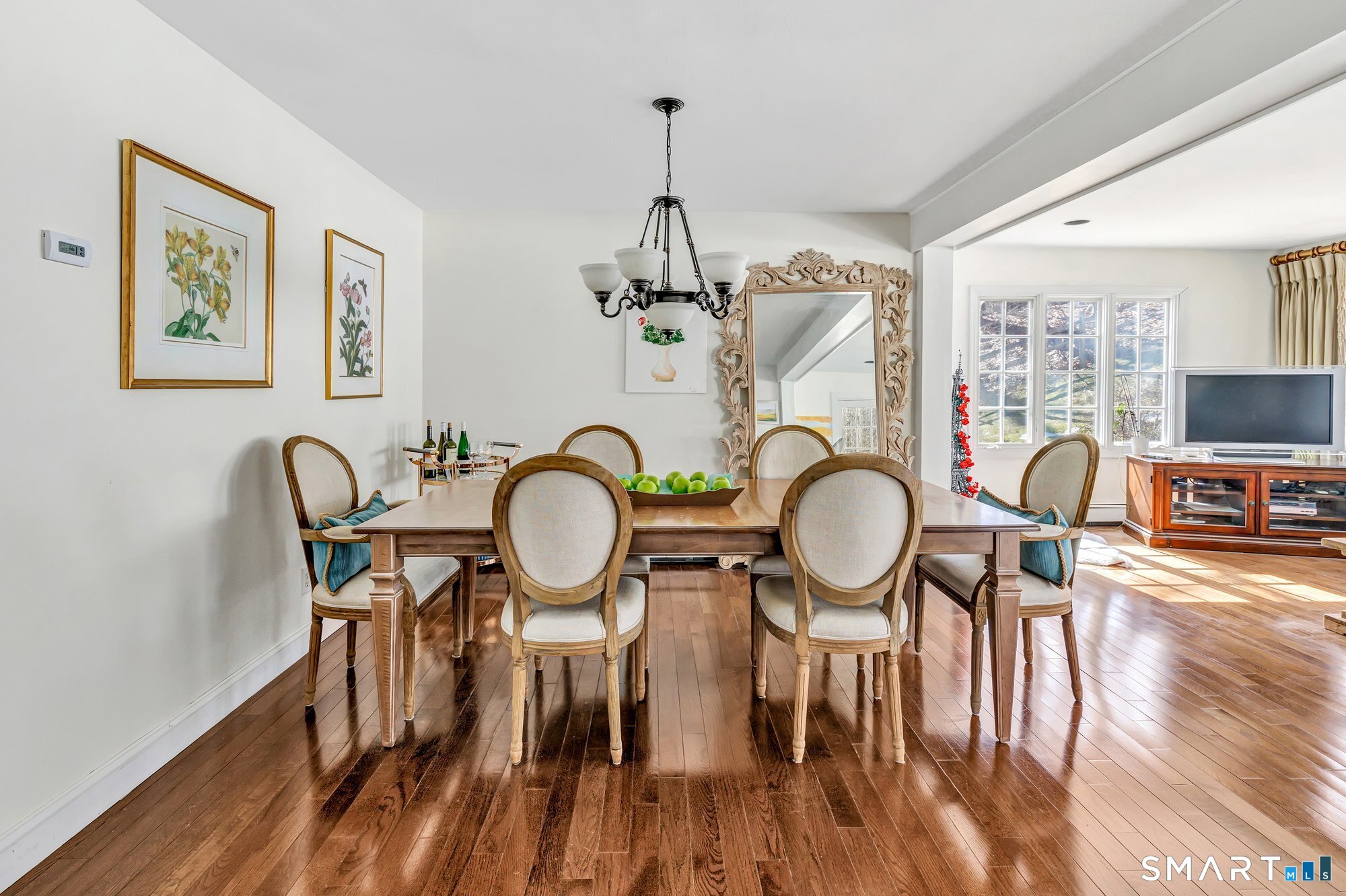 39 Marion Road Westport, CT 06880 - Photo 15 of 46 a view of a dining room with furniture a chandelier and wooden floor