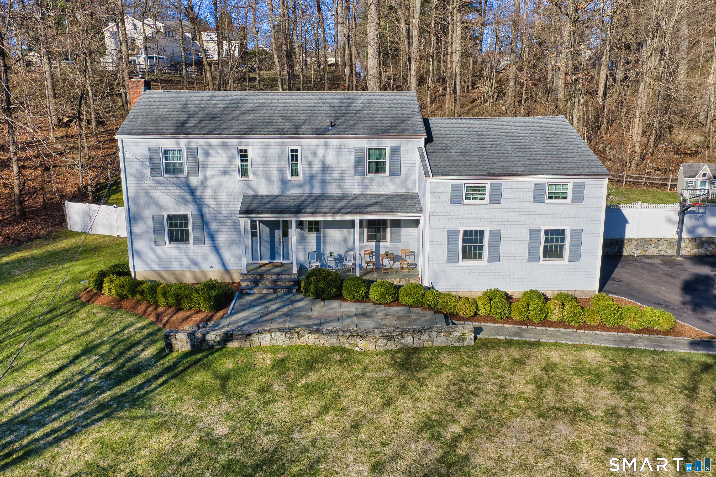 39 Marion Road Westport, CT 06880 - Photo 2 of 46 front view of house with a yard