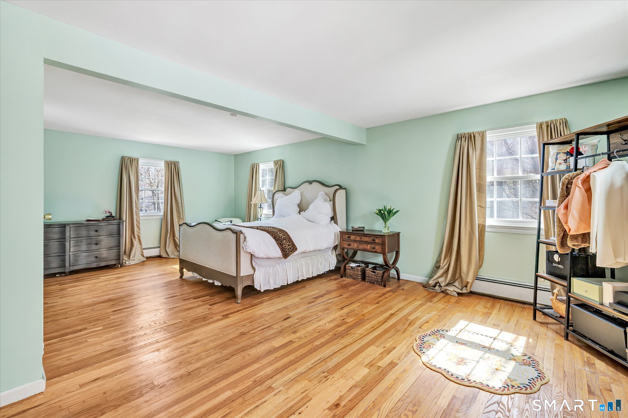 39 Marion Road Westport, CT 06880 - Photo 25 of 46 a bedroom with a bed and a flat screen tv