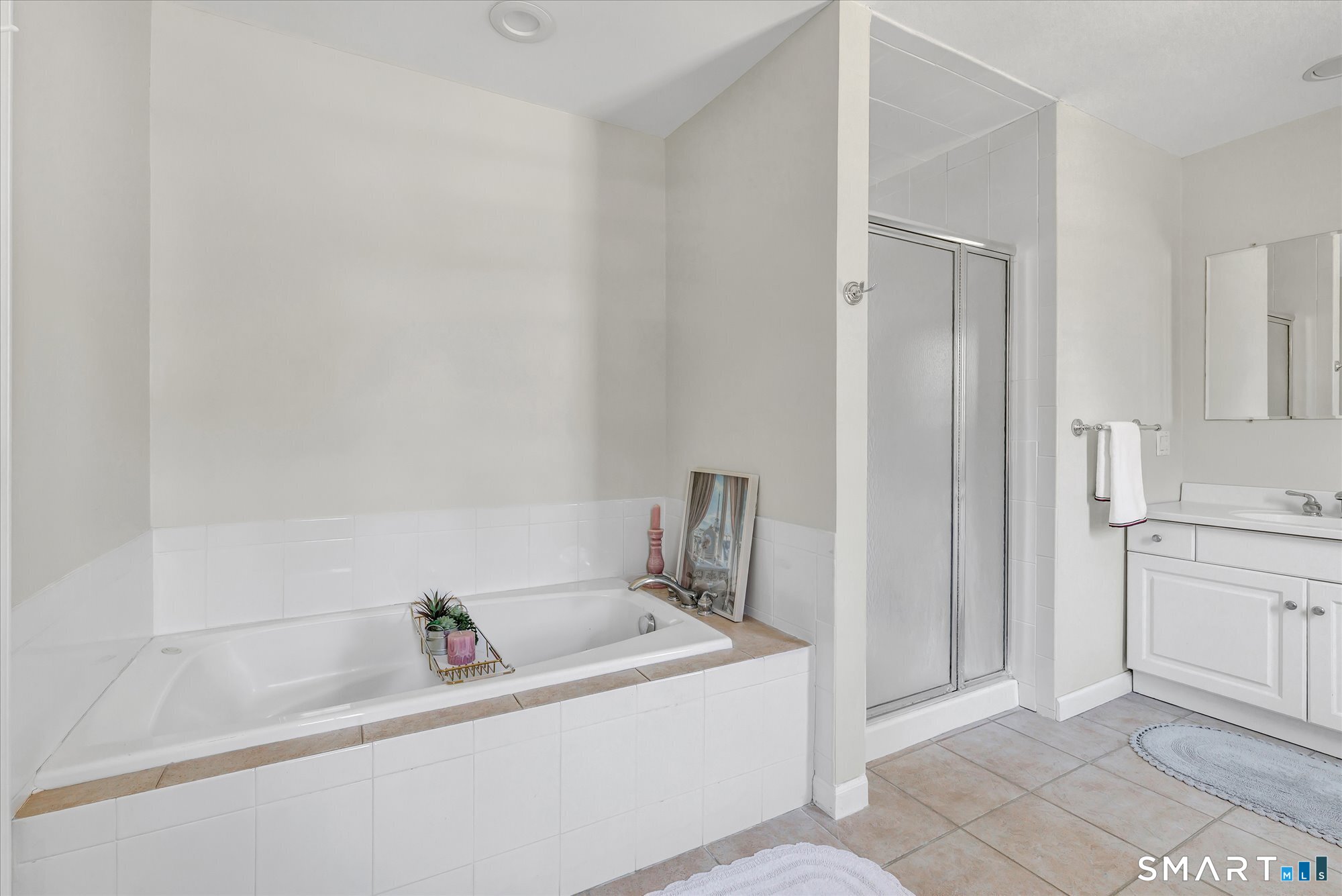 39 Marion Road Westport, CT 06880 - Photo 29 of 46 a bathroom with a tub sink and mirror