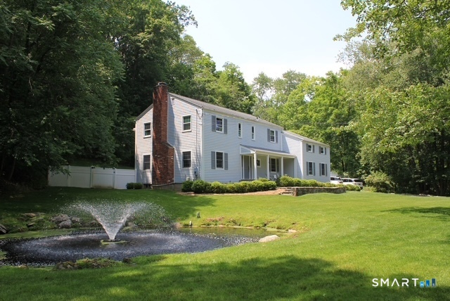 39 Marion Road Westport, CT 06880 - Photo 3 of 46 a view of a house with a yard table and chairs