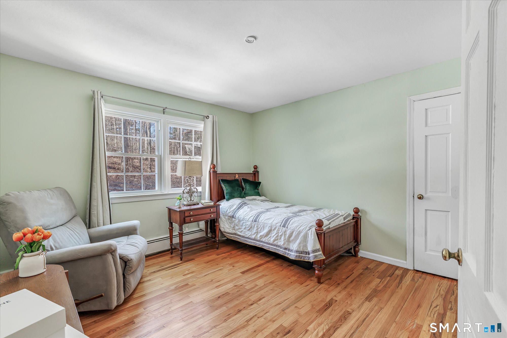 39 Marion Road Westport, CT 06880 - Photo 32 of 46 a bedroom with a bed and wooden floor