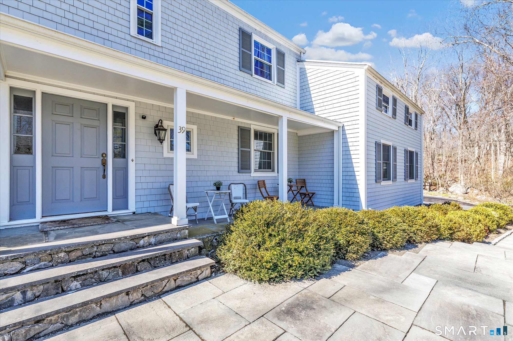 39 Marion Road Westport, CT 06880 - Photo 6 of 46 a front view of a house with a garden