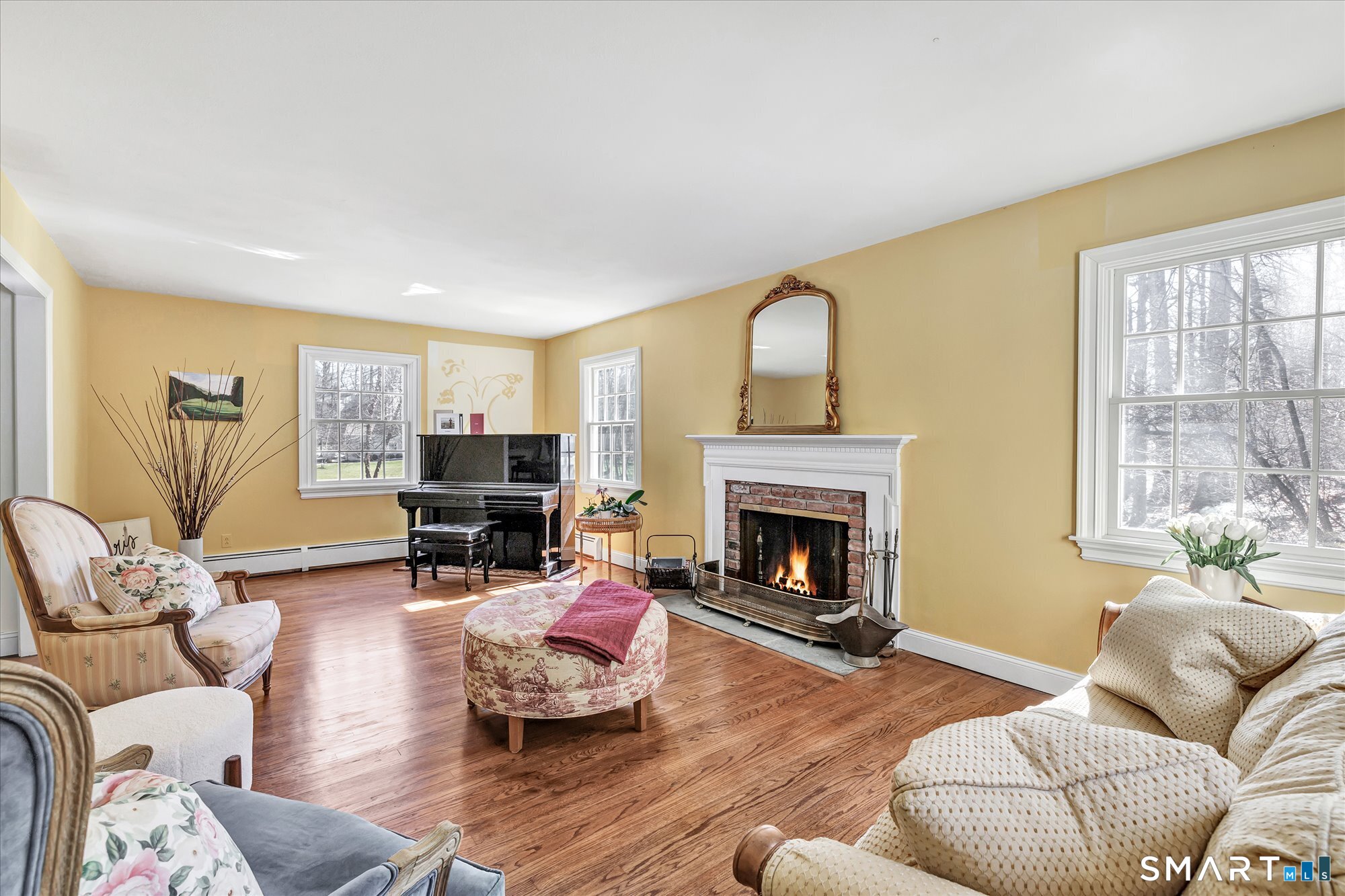 39 Marion Road Westport, CT 06880 - Photo 8 of 46 a living room with furniture and a fireplace