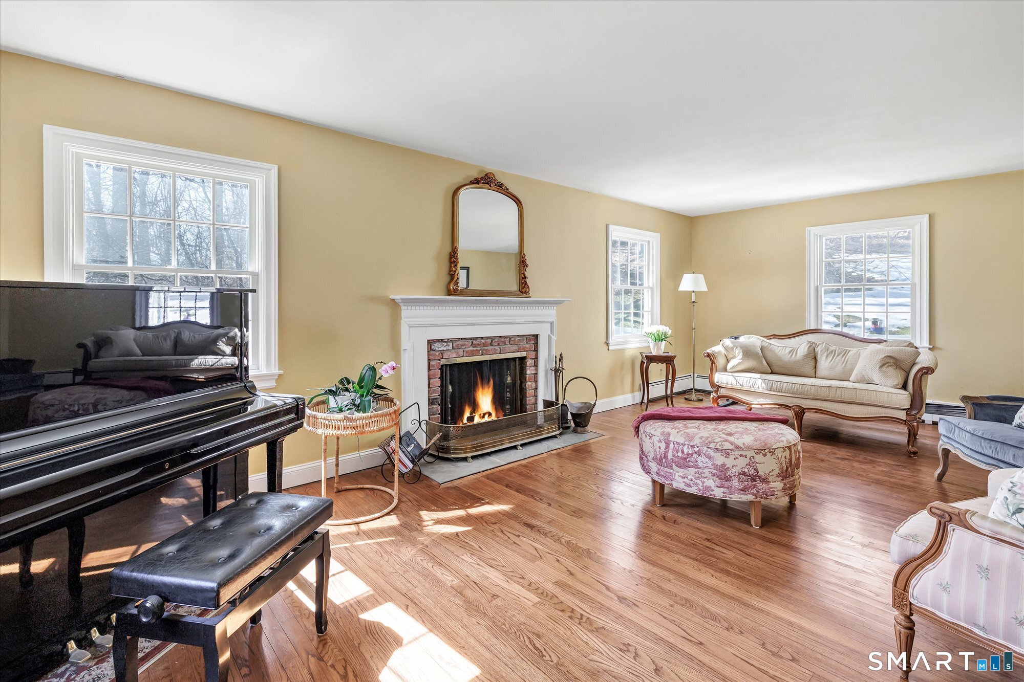 39 Marion Road Westport, CT 06880 - Photo 9 of 46 a living room with furniture or couch and a fireplace
