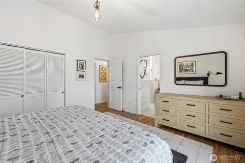 a bedroom with a bed and a dresser