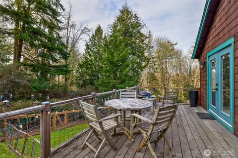 a view of a chairs and table on the wooden floor