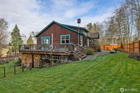 a view of house with a yard