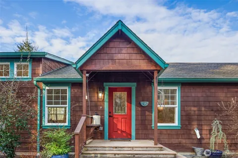 a front view of a house with glass windows