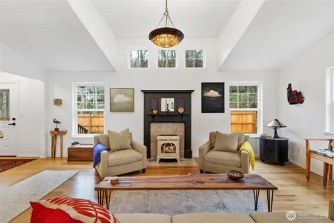 a living room with furniture and fireplace