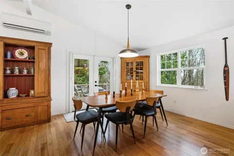 a view of a dining room with furniture window and wooden floor