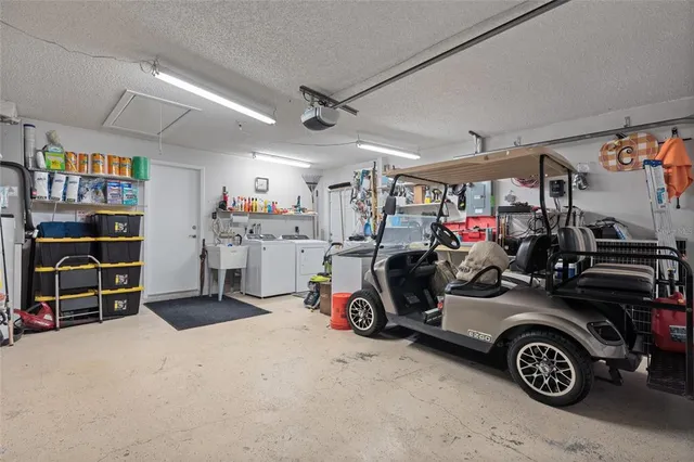 a view of parking garage with cars and other equipment