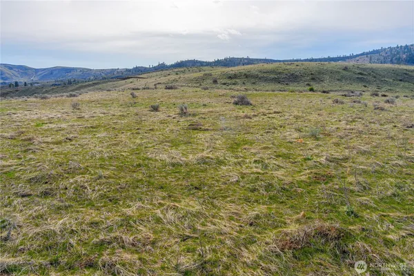 a view of wooden floor and a mountain view