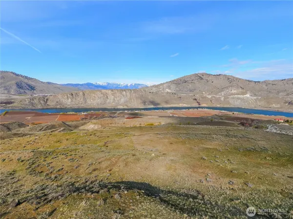 a view of mountain and an ocean beach